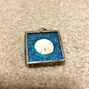 Jewel Kade sand dollar pendant